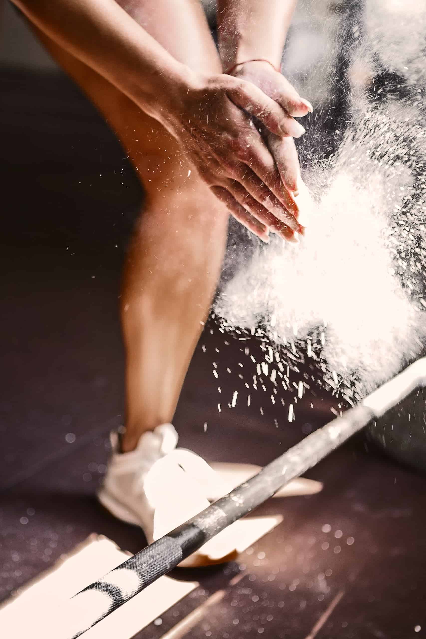 In Dorset, a woman is holding a barbell during her CrossFit routine.