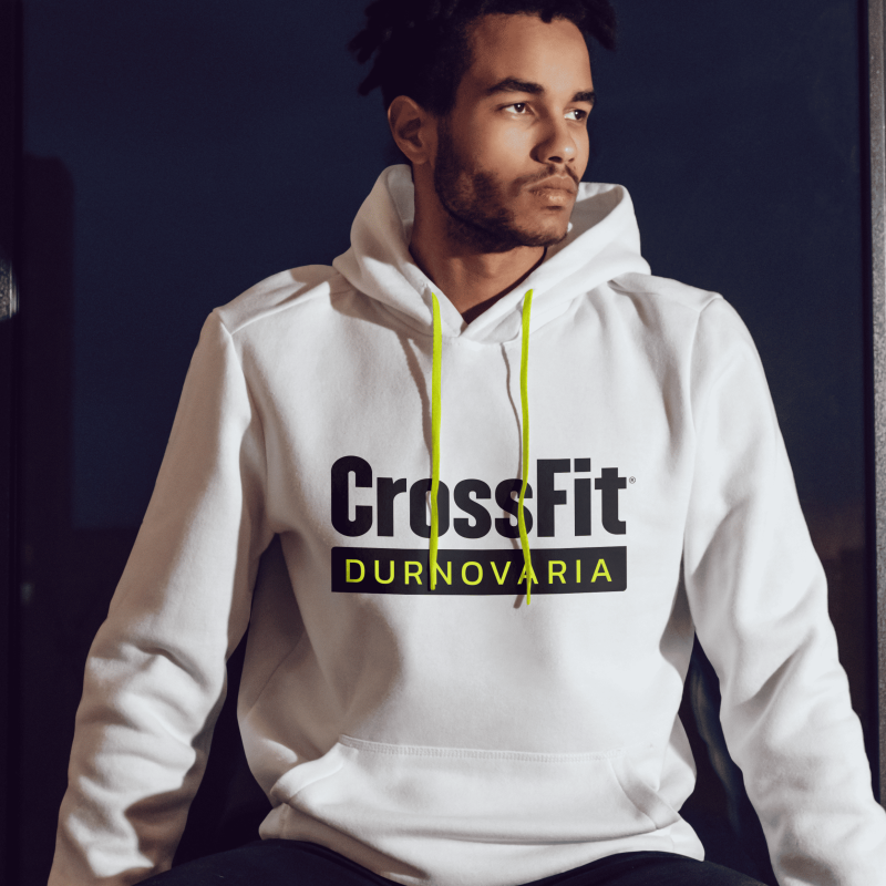 A man wearing a Crossfit Workout Active Hoodie sitting in a window in Dorchester, Dorset.